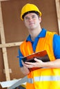 Thoughtful male worker holding a clipboard Royalty Free Stock Photo