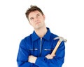 Thoughtful male worker holding a hammer Royalty Free Stock Photo