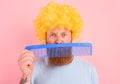 Thoughtful man with beard, yellow peruke and big comb