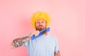 Thoughtful man with beard, yellow peruke and big comb Royalty Free Stock Photo