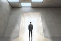 Thoughtful man in concrete office room interior standing at success door. Royalty Free Stock Photo