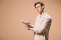 Thoughtful man in glasses holding notebook and pen isolated Royalty Free Stock Photo