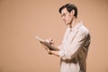 Thoughtful man in glasses writing notebook isolated Royalty Free Stock Photo