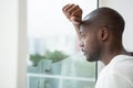 Thoughtful man looking out the window Royalty Free Stock Photo