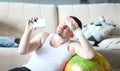 Thoughtful Man Shooting Training on Mobile Phone Royalty Free Stock Photo