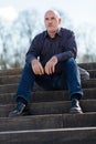 Thoughtful man sitting on a flight of steps Royalty Free Stock Photo