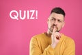 Thoughtful man and word QUIZ on pink background