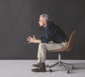 Thoughtful mature male on chair