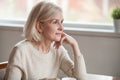 Thoughtful middle aged beautiful woman looking away drinking cof Royalty Free Stock Photo