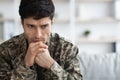 Thoughtful military guy staring at copy space Royalty Free Stock Photo