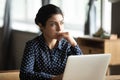 Pensive ethnic woman thinking over problem solution