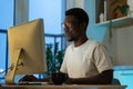 Thoughtful web developer work on computer, programmer trying to find solution for bug in app code Royalty Free Stock Photo