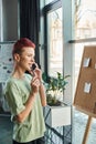 thoughtful queer person talking on mobile Royalty Free Stock Photo