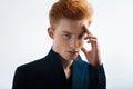 Thoughtful red-headed young man thinking Royalty Free Stock Photo