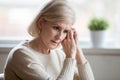 Thoughtful sad middle aged woman feeling blue thinking of anxiet Royalty Free Stock Photo