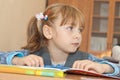 Thoughtful schoolgirl in classroom Royalty Free Stock Photo