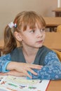 Thoughtful schoolgirl in classroom Royalty Free Stock Photo
