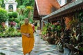 Thoughtful, seemingly indifferent monk in the shrine