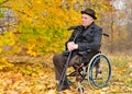 Thoughtful senior amputee sitting outdoors