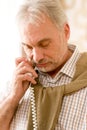 Thoughtful senior mature man call on phone Royalty Free Stock Photo