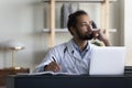 Thoughtful serious male doctor looking at window in office