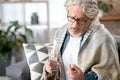 Thoughtful sick senior man taking medication Royalty Free Stock Photo