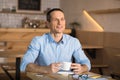 Businessman drinking coffee in cafe