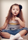 Thoughtful speaking style child looking fun. 4 years old girl Royalty Free Stock Photo