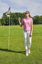 Thoughtful sportswoman with a club staring away Royalty Free Stock Photo