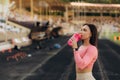 Thoughtful sporty woman sitting on bleachers at stadium Royalty Free Stock Photo