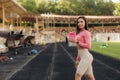 Thoughtful sporty woman sitting on bleachers at stadium Royalty Free Stock Photo