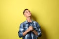 Thoughtful teenage boy on color background Royalty Free Stock Photo