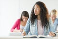 Thoughtful Teenage Girl Sitting At Desk