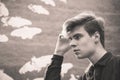 Thoughtful teenager boy black and white closeup portrait