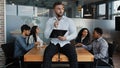 Thoughtful thinking pensive man leader boss businessman company CEO with document papers tablet sitting on office table Royalty Free Stock Photo