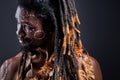 thoughtful tribal with dreadlocks looking at side Royalty Free Stock Photo