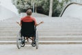 Thoughtful wheelchair man, can not climb the stairs has mobility problems