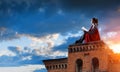 Super hero on roof. Mixed media Royalty Free Stock Photo