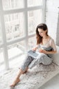 Thoughtful woman chatting on laptop Royalty Free Stock Photo