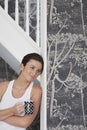 Thoughtful Woman With Coffee Mug Leaning On Door Frame Royalty Free Stock Photo