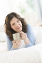 Thoughtful Woman Holding Coffee Mug In Bed Royalty Free Stock Photo