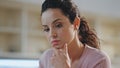 Thoughtful woman studying home holding pen close up. Portrait of girl freelancer Royalty Free Stock Photo