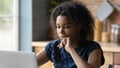 Thoughtful young african american woman working on computer. Royalty Free Stock Photo