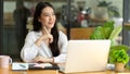 Thoughtful young asian businesswoman startup daydreaming about her work Royalty Free Stock Photo