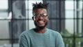 Thoughtful young black man in glasses looking straight ahead Royalty Free Stock Photo