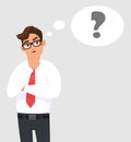 Thoughtful young business man is thinking and looking up. Question mark in the thought bubble. Human emotion, facial expression. Royalty Free Stock Photo