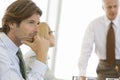 Thoughtful Young Businessman In Conference Room Royalty Free Stock Photo