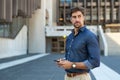 Thoughtful young businessman holding phone Royalty Free Stock Photo