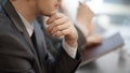 Thoughtful young businessman sitting at his Desk. close up. Royalty Free Stock Photo