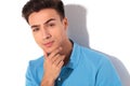 Thoughtful young casual man in polo shirt Royalty Free Stock Photo